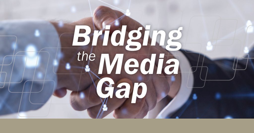 Two shaking hands behind the "Bridging the Media Gap'" quote