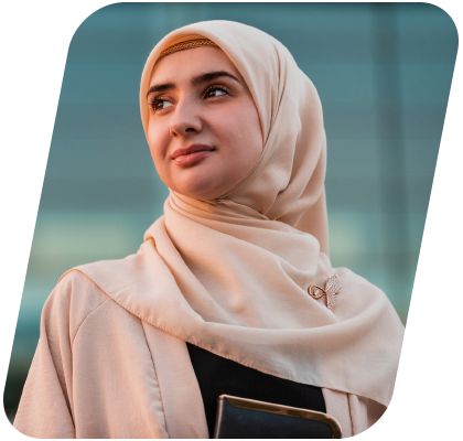 Confident businesswoman wearing a hijab looking forward thoughtfully.